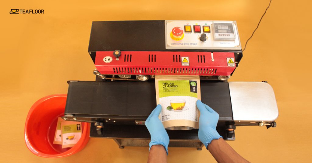 Image of Tea Packaging Through Sealing Machine