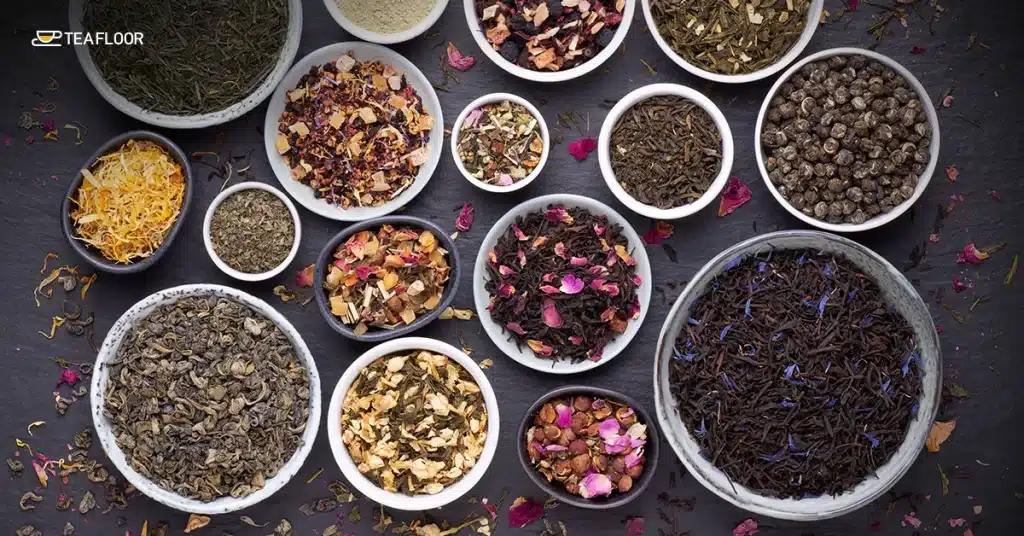 A variety of dry loose leaves in small ceramic bowls to test if tea expires over time