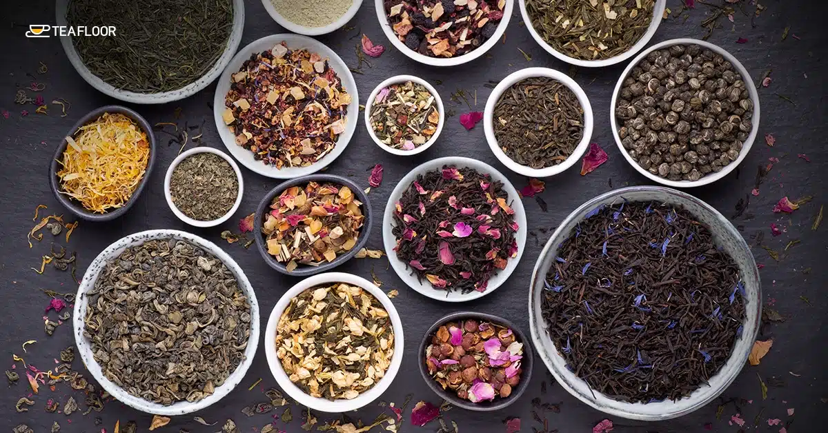 A variety of dry loose leaves in small ceramic bowls to test if tea expires over time